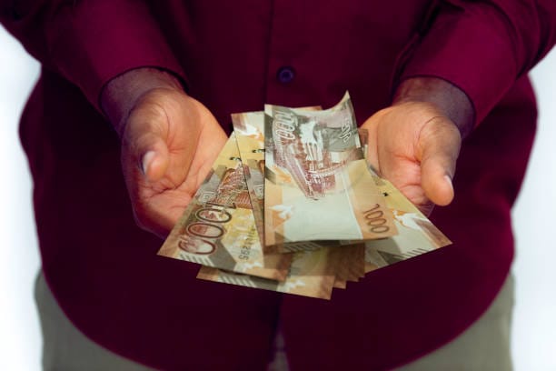 Kenyan money in open arms 