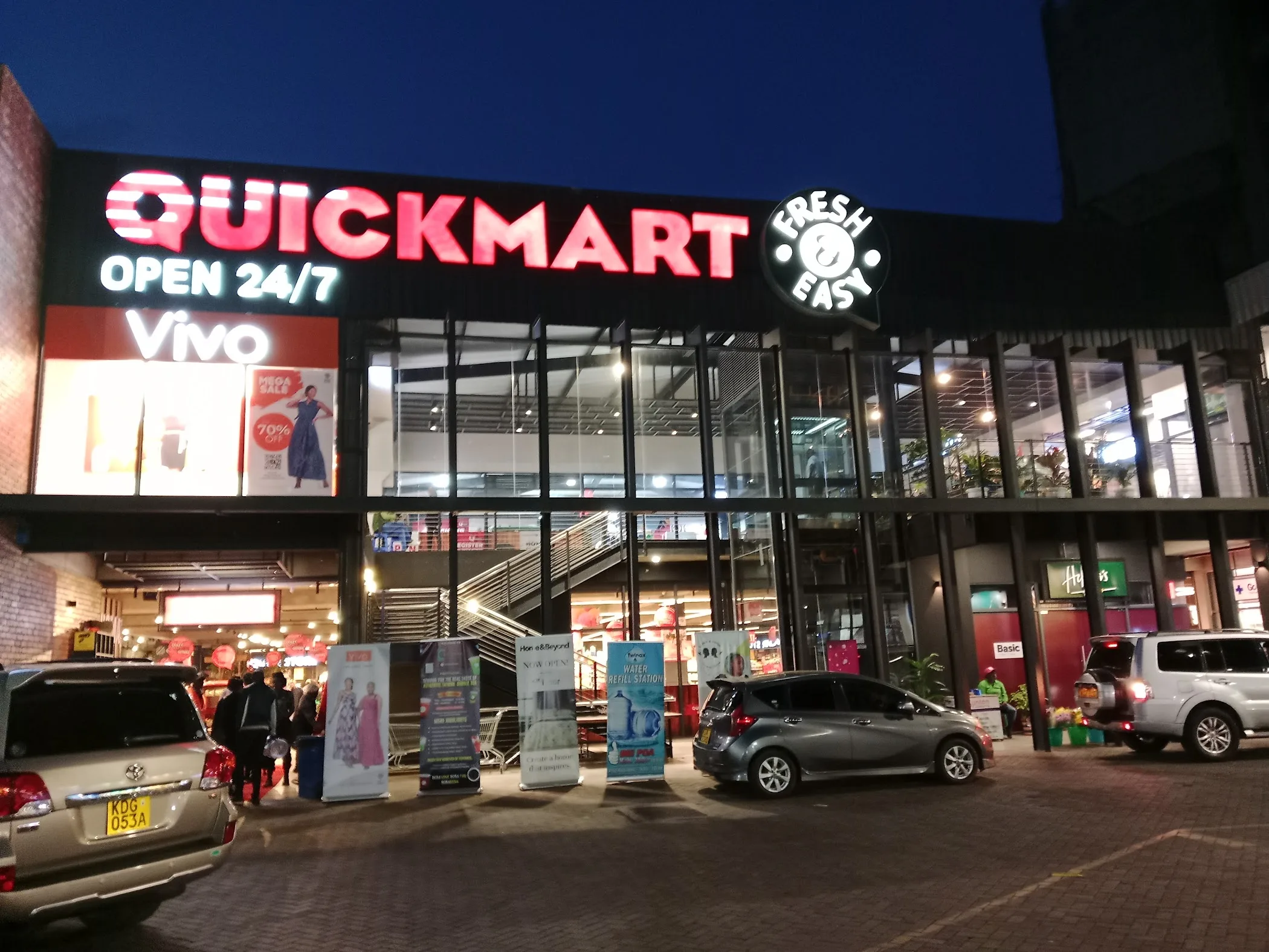 QuickMart supermarket store exterior with signage